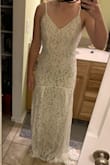 I ordered a lot of dresses and did not go with this one, but I like it.

The dress is very comfortable and hugged my body well. It got a couple votes as my friend's favorites, and the lace is lovely. It's a bit long for me, but leaves the option for a baby train if you hem the front. My biggest complaint is that the top wasn't as flattering for my small chest as I would like. If this is the style of dress you're looking for, I'd say it's a quality affordable option! - Laura S.