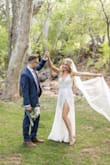 This dress beat out 5 other Lulus dresses I ordered. It was the perfect wedding dress for my creekside wedding and I'm so glad I didn't add a lining to it. I was nervous because it is sheer but honestly, I don't think anyone even noticed that because the lace is sturdy enough. I ordered an XS and I thought the straps were slightly tight around the shoulder areas but I think a size up might have been too loose, and I do have semi-broad shoulders. I received so many compliments on it!! 
The length was also perfect for my height (5' 7.5") with pretty short heels (as you can see in the picture, those were maybe 2" - 3" heels). The quality of the dress is incredible, and I actually would love to wear it again but I don't think I can due to it being my wedding dress. - Alexis J.