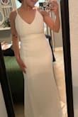 I am so extremely happy with this purchase! I am 5'1 so the dress is long on me! I had to tighten my straps, hence the double strap appearance. Because this is just an elopement I may just cover with my hair but I am considering altering the straps because it looks beautiful when worn properly. I personally don't mind the dragging of the dress because it's not much and I am going to wear heals! I got a size small and it fit perfectly and really formed my body in a way I like! My picture does not do it justice, I promise it looks Amazing in person!
P.s. it comes with a dress cover (bag) so you're able to store it in your closet! - Adriana A.