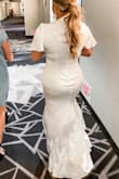 This dress is amazing and does wonders for your bod. I am typically a medium but purchased a large because I was nervous about it being too small. I ended up having to get it taken in everywhere but the hips and it fit like a glove. Shapewear recommended because it is satin. Buy this dress, don't wait! - Traci M.