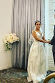 Hands-down out of all the dresses I tried this was the winner. This dress was perfect for my Vegas wedding. More beautiful in person with the metallic detail. I added the Truly a Vision Silver Rhinestone Bridal Belt for extra flair. Thank you Lulus! My wedding day was perfect! IG @sheis.mandi for additional pic. - Amanda T.