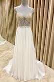 The dress is simply stunning. Even the bridal shop that did the alterations said that the dress was beautiful, and the beadwork was lovely. I cannot wait to wear it on our special day. - Aerin C.