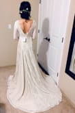 This dress looks very similar to my dream wedding dress I had wanted for years that is now worth around 3000. I was hesitant to try on the Lulus version but decided to just go for it. Unfortunately they did not have my size (XS) so I went for a small. This dress is extraordinary. The way the dress hugs your body and the train is absolutely gorgeous. The mixture of material gives the train of this dress a beautiful flow, I felt like a princess! This dress and its detail is so much more beautiful in person. The reasons why I did not choose this as my dress was because it wasn't my size (though the small still fit well), there is also quite a bit of material to this dress, so it feels slightly bottom heavy (great quality, feels amazing but wouldn't work for my wedding situation). If you are debating whether or not to try this dress on, do it!! It is so beautiful, you won't regret it! - Kayla L.