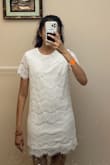 I bought this white dress in an extra small for graduation. It's cute, modest, but a little basic. Being a thin girl, it's a little unflattering because it's loose and shapeless up top. It does hug my butt somewhat, which I like. Overall, good quality. I'm keeping it and wearing it for graduation because I'm gonna be wearing a cap and gown over it anyways. - Anisha A.