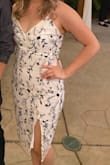 True to size and I love that it has a slit definitely made the dress a little more comfy. It is slightly see through if you wear dark underwear underneath. I definitely would recommend to pair it with some shapewear. Overall great dress! - Melanie G.