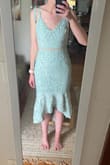 It's a pretty dress but not the most comfortable. The fabric is very stiff, the dress doesn't have any stretch. It fits true to size though! The top was too big on me and I didn't love it enough to pay for alternations, so I returned it. - Morgan C.