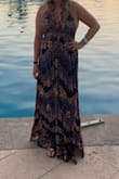 This dress is so beautiful!! Very flowy, with slits on both the sides. The ties however are made of a harsher cloth, caused rubbing around my neck. I had to put a band aid on my neck to protect it. Other then that very comfortable. - Julie V.