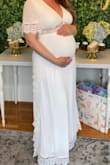 I sized up to wear for my baby shower. I'm usually an XS, but got the next two sizes up since I'm pregnant and wasn't sure about fit. The Small fit fine, but the Medium was more comfortable/flowy for me at 33 weeks so I went with that size. It was perfect. I do want to point out that I had to wash the dress due to a strong warehouse smell when I received the dress. I followed the instructions on the tag, hand wash in cold water and air dry, but the outer layer of dress shrunk. I had to take it to my seamstress to hem the inner lining. She also found that the lace on the sides should have been sewed to the inner lining to look better; it was just a bit odd that it wasn't. It was extra $$$ to fix these minor issues, but luckily with these alterations, the dress looked beautiful on me! Best of all, it was comfortable to wear all day. - Mirosleidy T.