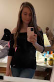I'm in love with this shirt. I want to buy more in other colors. I might even buy another one in black as a back up- that's how much I love this shirt. It is super flattering and the material is good quality. I love how it doesn't go above the shoulders - it stays put! I ordered a small and it's perfect. - Kristena R.