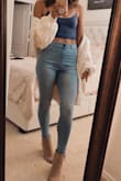 I first purchased this tank in white, fell in love with it (wore it ALL the time). Came back for the navy blue, with more in the shopping cart ready to purchase. I wear these bra-less (itty bitty club!) and find them to be super comfortable and perfect with high waisted bottoms. - Hayley A.