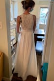This dress feels wonderful - very comfortable fit and nice weight to the skirt. The fit was just as described. I purchased this as an option for a wedding dress for an intimate backyard wedding, and chose another option, but this dress was really lovely. - Katherine T.