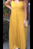 I wore this for my senior prom and got tons of compliments on it. Very pretty color; I had to hem it a little shorter because I wore flats instead of heels, but it fit great otherwise. - Bonnie K.