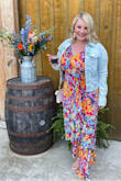 Loved, loved, loved this dress for a recent summer country wedding outside of Nashville. The dress was a tiny bit loose and long; I'm 5'4, typically a 10/12, wore wedges and it hit the ground. If I had more time I likely would have gotten it altered, but didn't necessarily have to. Probably would not have sized down as it was nice having a little extra room for mac and cheese, ha! I also loved that I could wear a standard strapless bra (it wasn't too low cut like a few other Lulus dresses that I've recently purchased). I paired with a jean jacket. Highly recommend this dress, the colors were so fun and bright! - Marta Z.