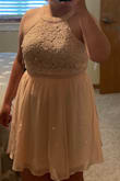 I love this dress, and I was so excited when it was finally back in stock! The color and lace detail are beautiful. I wore it for high school graduation. Without really looking at the size chart, I ordered the size that I usually wear in most everything. It was slightly tight around my upper stomach, and we were worried that it wasn't going to zip all the way up at first, but it did, and the tightness level wasn't to the point of being uncomfortable. I think if I had ordered the next size up, it would've been too big in other places, so it worked out beautifully! Thank you! - Camyrn L.