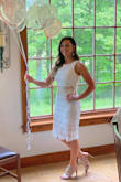 This dress was perfect for my bridal shower. The skirt runs long, but looks good with heels. Don't think it would with flats. I wish there was more of a gap between the 2 pieces. The top could have been a little see through, but I made sure to wear white underneath! - Kristen G.