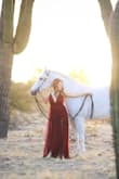Honestly fell in love with this dress but I was between sizes so I was a little nervous about ordering a small. This dress fits 100% true to size! I dont have the biggest bust so the adjustable straps were a live saver! I bought it for a fun photoshoot with my horse and oh my goodness it was magical. It is long, but it worked for what we were doing. (: Will definitely be searching out occasions to be able to wear this dress again. I'd recommend getting it hemmed professionally as tulle can be tedious. As a whole, it felt very high quality, was breathable, non-constricting, comfy, beautiful, lightweight...the list goes on!! Love love love. - Victoria B.