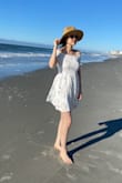 The dress fits me perfectly. The fabric is soft and comfortable. - Tran D.