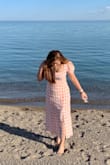 I'm in between small and a medium so I chose the medium and it is a bit loose but I still loved the way it looked. The quality is great and I really like the style. Its worth it! It looks more like a maxi dress since I'm pretty short but I'm not complaining! - Catrina P.