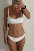 This bottom did not fit me like the model. I wish it did. I think for someone comfortable with wearing white, this is a cute, basic bottom; not too cheeky, and not super full coverage. I just don't like how it bunched up on the bottom. Good material though. - Lynette B.