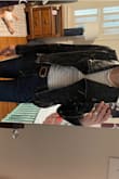 Super cute black jacket. I love it and will most likely wear all the time. It's tight in the shoulders, and the arms, and I am long and slender. Sizing up is a must. - Amber B.