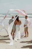 This dress was absolutely amazing. I bought it for our small beach ceremony after having to postpone our "big" wedding due to state restrictions. It was the PERFECT beach dress. I got so many compliments it was super comfy. I got in it around 9 am (ceremony was at 10 am) and didn't take it off until 1030pm I was obsessed with it. - Reva Q.