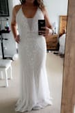 This dress fits perfectly! It was a little loose up top but when I tightened the straps it fit perfectly! I may uncross the straps, I am not sure yet. I am 5'6 and the dress is on the floor. It has a very good stretch, looks and feels expensive!! - Josselyn V.
