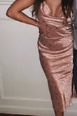 I wore this to a wedding, and I promise you I got 10 or more compliments in this thing. The fabric is yummy, silky and the cowl neck line is the perfect amount of cleavage. The straps are adjustable, but slide a bit if moving around or dancing. I have a large booty and bust (i didn't wear a bra with it). The slit with my large behind was a bit of an issue with sitting down...I had to hold the dress closed cause the slit showed my whole upper thigh. Also, the dress is easily snaggable with jewelry, so be careful with that. I felt like the hottest person at the wedding, and you will too! I'm usually a medium, but sized down due to previous reviews and I'm glad I did. the small fit like a glove. - Mackenzie G.