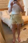 Bought this skirt for a vacation. The fabric feels like linen, and it does wrinkle kind of easily. It is lined and very comfortable to wear. The colors are really cute too, although it's hard to tell from the photo. All around good summer shorts to throw on. I'm glad I bought them. - Chelsea H.