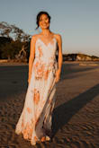 I got this dress for my engagement photoshoot and couldn't be happier. It was very fitting for the beach and sand background. It was super comfortable as well. - My T.