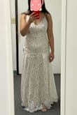 I first ordered the small size thinking the waist would need to be the ideal fit for this dress to work on me. However, when I ordered the small I realized the little pleats on the bottom were stretched in a horrid way. When I sized up (as shown in the pictures) the pleats look a lot better. However, the length is then too long and the waist is too big (I'm cinching it with my other hand in the picture) so there's bubbles of excess fabric in the back. Perhaps this dress is ideal for a straight and narrow body. I don't mind doing the alterations but I would say it's not the ideal dress for pear shaped ladies. - Jean P.