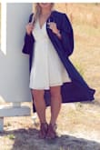 I ordered this dress for graduation pictures and it was perfect! The dress itself is gorgeous. Material was soft and delicate but also thick enough not to be see through. Graduation was a windy day so I did have a few "Marilyn Monroe" moments :) But the strings to close the wrap dress really helped it stay in place and stay closed. When I wear this without wearing it under my graduation gown, I may have to pin the bust line, but more for my own comfort. Normally I run medium/large and the medium was perfect. The large would have been too big. This is my first time ordering from this site and I am very happy with my purchase. I paid extra for shipping to ensure I received it in time, and it came 3 days before I expected. - Ashley R.