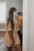 This romper is so cute! I ordered a size XS and it fit perfectly. I wore it this past weekend and got so many compliments. I want to order it in EVERY color. - Ajia P.