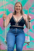 This is a very cute body suit and I felt very sexy in it, but there is no give. I'm a curvy woman with large hips and a stomach so I ended up popping a couple stitches. The straps are thin so they dig in a little. My breasts stayed covered the whole night I wore it. It's one of those bodysuits where even though there were a couple annoyances, it was worth the wear. I will probably wear it again for special nights out. - Hailey M.