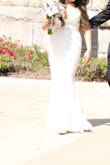 Beautiful lace, very long, I wish they would make a petite version as I'm only 5'0. I got size XS and it was long, but I got it altered and wore heels. Also got a belt from Amazon and made it look even better! - Viviana G.
