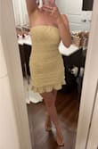 Love the dress. It reminds me of for love and lemons. It's not stretchy at all and holds everything in. I entered my measurements and I'm definitely snugged in but I think sizing up to a medium would be too big. I probably don't even need to wear a bra. - Jessica R.