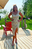 Love this dress! I got a medium and it fits a little loose around my waist but not overly. I could have sized down for sure. The lace feels very high quality and I love that the ribbon sleeves are adjustable. 

Wore it to my rehearsal dinner and everyone kept complimenting it. - Hannah L.