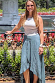 I listened to reviews and ordered a size down from normal as it truly does sit on your waist and my waist is small I just have wider hips. Medium fit perfectly. I got compliments from strangers wearing this. It does wrinkle a lot after first wear and wash but washes well. It was so flowy and great color I am planning on wearing it lots this summer! Length was just right to not drag with flats and im 5'6. - Jackie M.