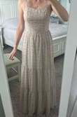 Originally ordered a small and couldn't even do the zipper up, so definitely order up a size. Very lightweight, ideal for a hot climate. Comfortable and well made. Very happy with the dress. - Zoe C.