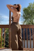Length is perfect! And the fit around my hips is amazing. Love how I can tighten it around my waist and chest with the strings. Just wish there were small secret hooks in between the buttons because when I tightened it enough to hold my bust in and keep it up, I get nervous some of the buttons will break. Overall loveee this piece :) - Madelyn K.