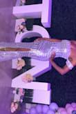 I wore this dress to a prom themed 40th birthday party and I received so many compliments. Even the birthday girl told me I would have won an award for best dressed female/"prom queen" if she were giving it out for the ladies (she was the "prom queen" lol). It really does shine and arrived exactly when estimated. Also the photo attached wouldn't allow for me to turn it, but you get the idea. Thanks Lulus! - Jacqueline H.