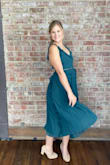 The dress was very cute and nice quality. Perfect for a wedding guest. Dress was snug snug a long waist line. - Meghan B.