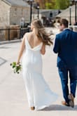 I bought this for our civil ceremony, and it was perfect! I had it altered to fit, as the top was a little large for me (small chest). I got the length hemmed to be a little shorter in the front, and to touch the floor in heels. - Kayla G.