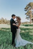 I can't say enough about this dress! I tried on 5+ wedding dress styles from Lulus and this one stole the show as soon as I put it on! My husband and I eloped (#thankscovid) and this dress was just perfect for the bohemian style we were going for. I did end up sewing the split down the front center of the dress a few more inches (it was a little too high for my taste) but didn't have to make any other alterations. Fit like a glove and got so many compliments! Don't hesitate to buy this dress!!! - Erika G.