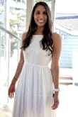 I bought this dress in hopes of wearing it for engagement photos but it just wasn't quite what I was looking for. It felt a little more casual like something I would wear on vacation but didn't necessarily have the romantic look I was hoping for. It fit well throughout the body. Was a little long. I'm 5'8 so if you're shorter you'll def need to have it hemmed. I think one of the reasons I didn't like it is because the neckline is high. I don't have large breasts (32B) and it just wasn't the most flattering on me since a big part of my upper body was covered. Also my torso is pretty short compared to my height so I think that played a factor as well. I think if I was going to wear my hair up it might have been better. Overall it wasn't what I was looking for, but I did find a different dress on Lulus that will be perfect and is exactly what I was looking for. - Amanda L.