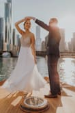 I purchased this dress for my boat elopement and couldn't be happier! It was extremely comfortable to wear all afternoon/evening. Didn't need to wear a bra, which is a plus. I was nervous about the quality of the beadwork for the price, but it is gorgeous! The skirt portion is 3 layers and not see through at all. Amazing quality! I did have to have the dress hemmed. I also had the straps adjusted (slightly smaller) but they would have been fine as is. I received so many compliments on the dress and felt so beautiful in it! I would absolutely recommend this dress to anyone thinking about purchasing! - Caitlin H.