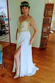 This dress is very beautiful and extremely well made! It is perfect for an outdoor wedding, as I will be getting married on the beach next month! You will need help lacing up the back as it is a corset tie, other than that this dress is very easy to get on and off! The beadwork is very eye-catching and the slit in the side is so sexy! Wearing a bra with this would be tricky, luckily I don't need one. You may have to get fancy with some boob tape if you are going to require a bra with this dress - Heather R.