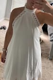 This dress could be so cute but it doesn't seem to be made right! Extremely loose.. I don't know how this could fit anyone the way the lace is laid! That's how far it comes out on both sides, while zipped/tied tightly. I'm usually a strong medium, sometimes large, and this medium should be an XXL.. - Lexie S.