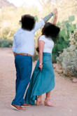 Wore this skirt with a white bodysuit for my engagement photo shoot in the desert. The skirt looks stunning in the photos! I usually wear a size small, but I ordered a size small and medium just in case. Ended up returning the small as it was just a tad tight and showed my bellybutton through the material. The medium was perfect. So glad I bought this skirt! - Michelle W.