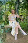 I love this dress! I bought this dress/outfit (shoes/necklace) for a wedding guest dress, and I couldn't be happier. I received many compliments, and I felt like a million bucks in it. As previous reviewers mentioned, the bust was a pretty iffy fit - I wore a padded/push-up bra, which helped fill the fabric in a bit, but definitely still needed to use a safety pin & some dress tape for added coverage. I loved the high-low cut of the dress, and how flowy and breezy the dress was, while still having a modest under layer/built in slip. Being a short girl, it was quite long in the back, but a tall pair of heels did the trick! Would definitely recommend if you don't mind being a bit flexible with adjusting the fit to your body a bit. - Rachel S.