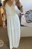 I ordered an XS originally for my wedding rehearsal dinner coming up (usual size for me ranges from XS-S) it ended up being a little long and a little loose up top so I ordered an XXS instead. The one I had received had a little bit of a greyish spot/stain on it so I contacted customer service and they sent me a new one right away! The returns were easy and the friendly customer service was very pleasant. I can't wait to wear this to my rehearsal! - Carrie K.